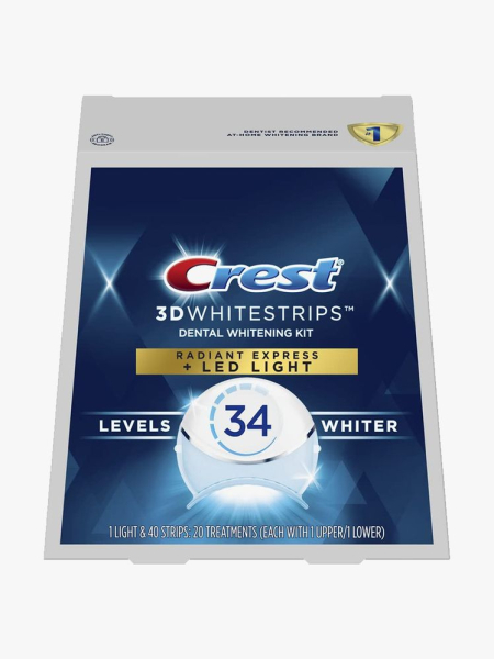 The Crest 3D Whitestrips with LED Accelerator Light on a light gray background